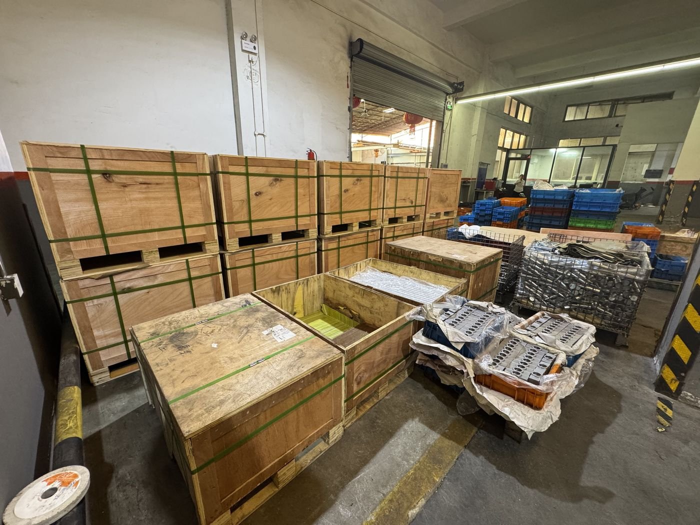 Plywood export crates and finished valve blocks prepared for shipment at the factory