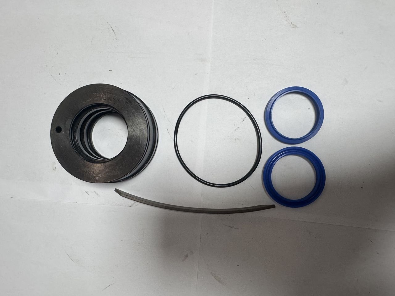 Cylinder piston head, O-rings and polyurethane seals prepared for assembly